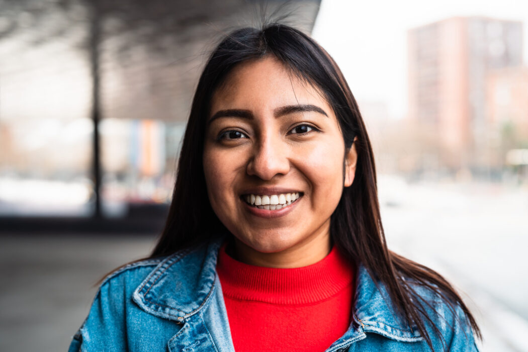 Happy native American young woman smiling in camera