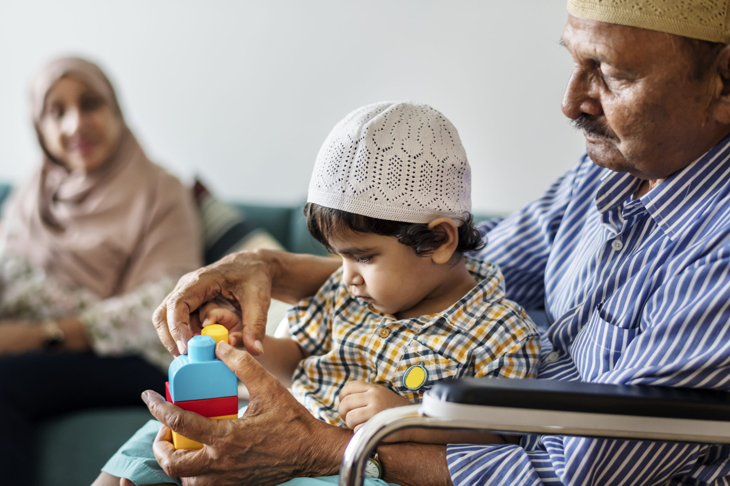 Muslim family relaxing and playing at home Muslim family relaxing and playing at home